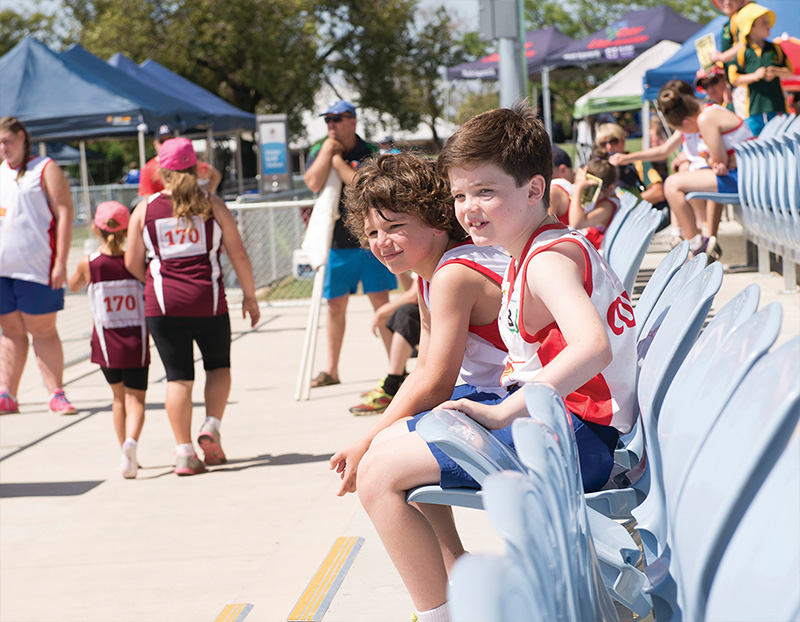 Image of Spectators and Competitors of Little Athletics